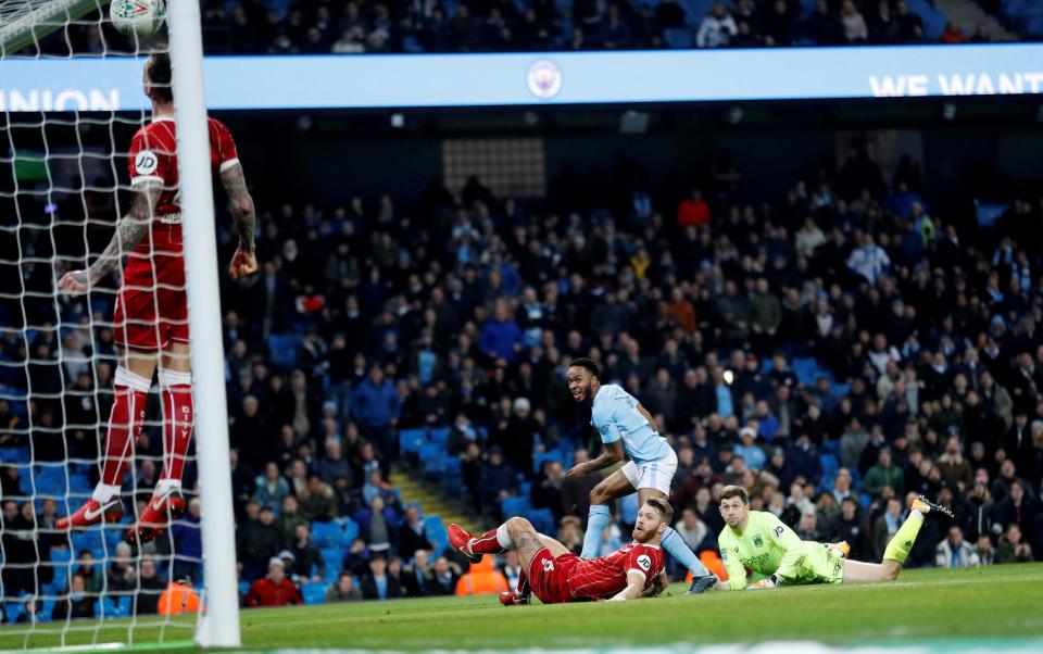  Aden Flint heads Raheem Sterling's effort off the line