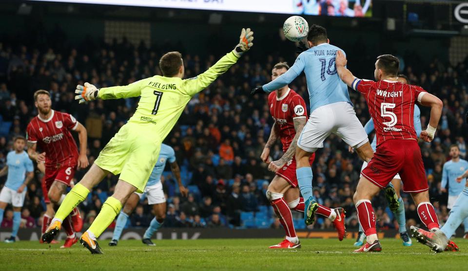  Sergio Aguero rises to head Manchester City into the lead