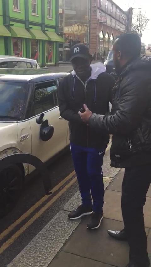  N'Golo Kante standing next to his smashed motor