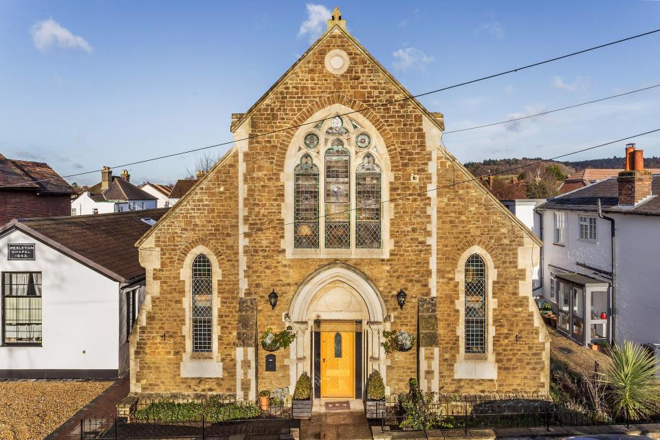  The imposing brick building boasts original stained glass windows