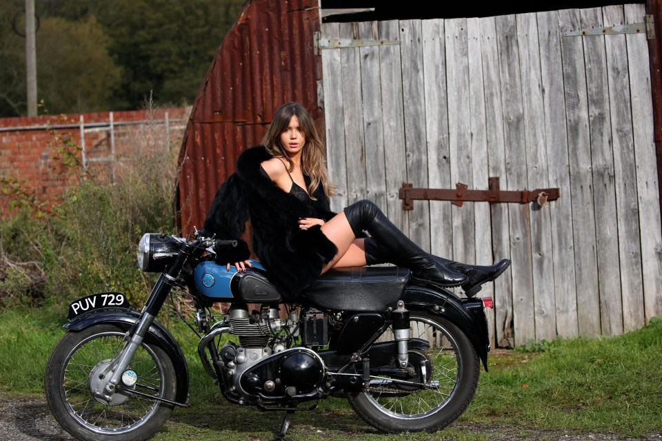 Elle Clancy strikes a racy pose on a motorbike