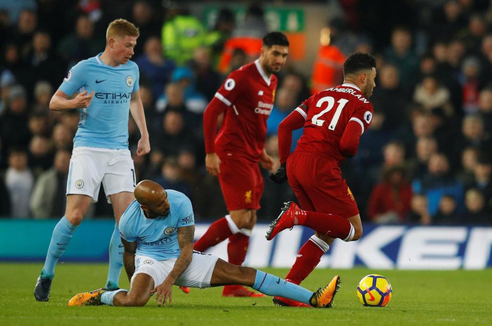  Delph appeared to jar his knee after a tackle on Oxlade-Chamberlain