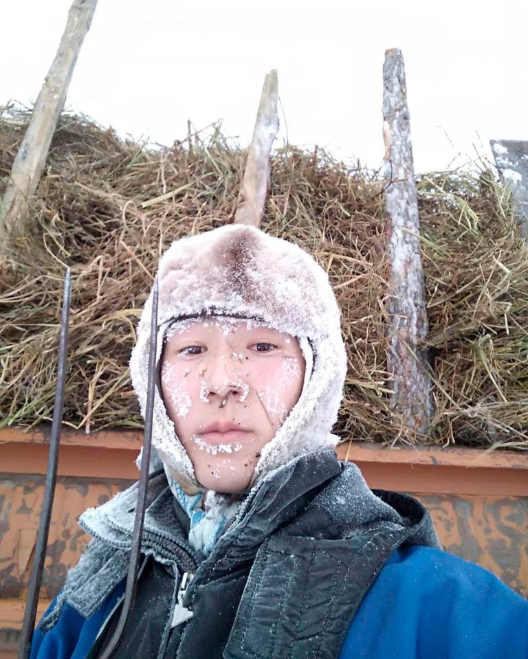  Another local poses for a photo with his face covered in frost