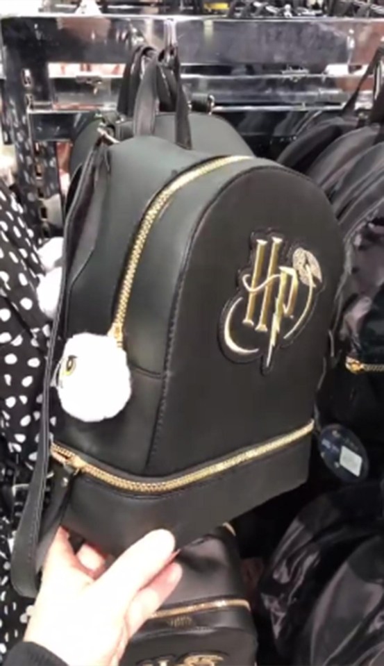 This black rucksack has large, gold lettering spelling out Harry’s initials, along with an adorable Hedwig pompom on the zip