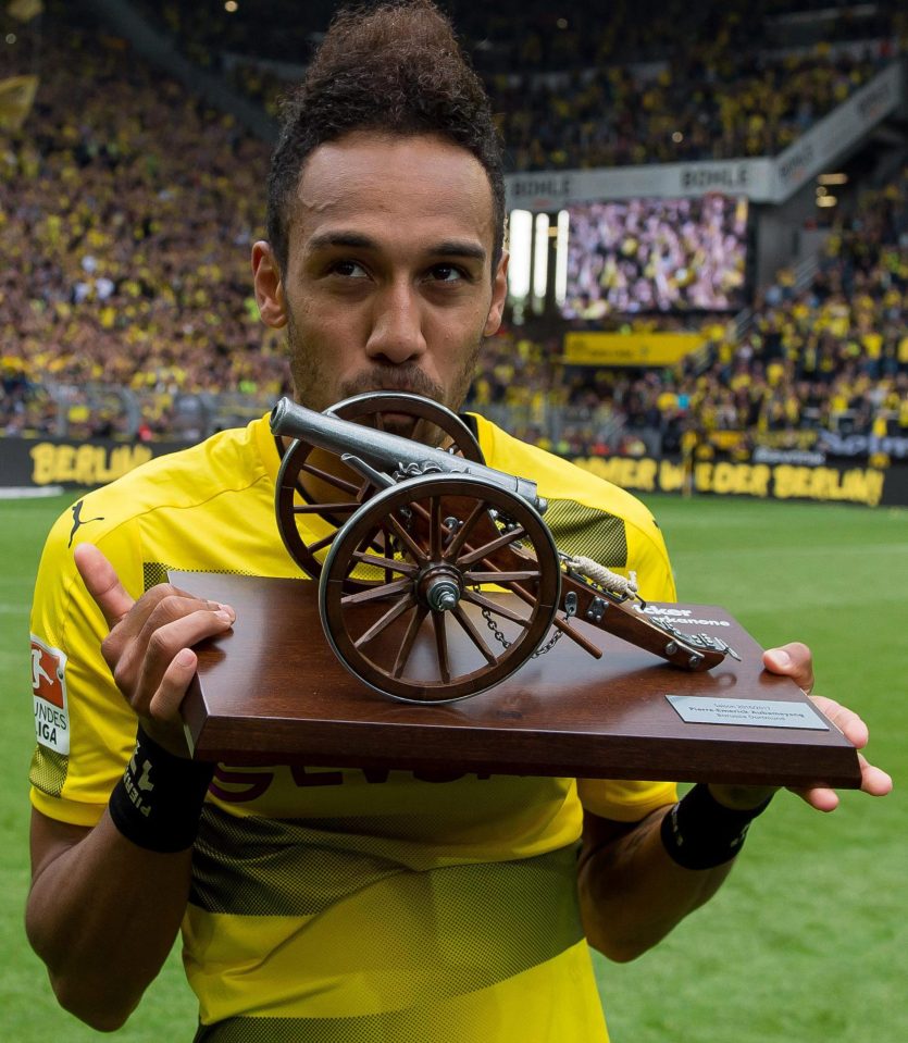  Aubameyang celebrates getting the trophy for being the top scorer in the Bundesliga