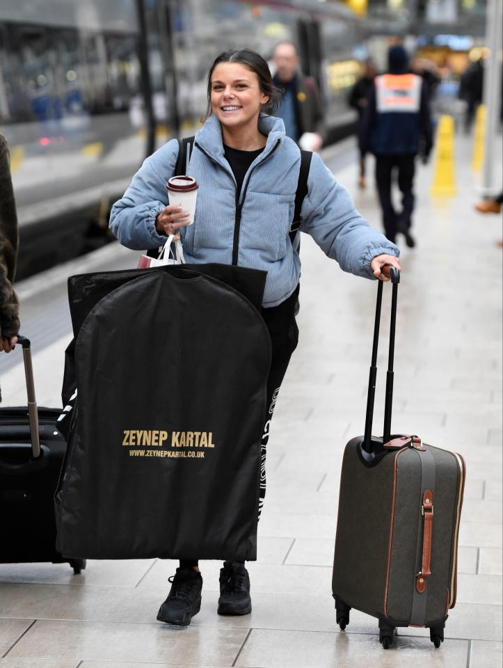  Faye Brookes grinned from ear to ear while carrying her bag