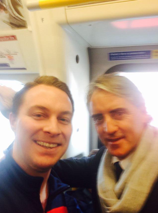  SunSport's Gary Stonehouse poses with Roberto Mancini on the Tube