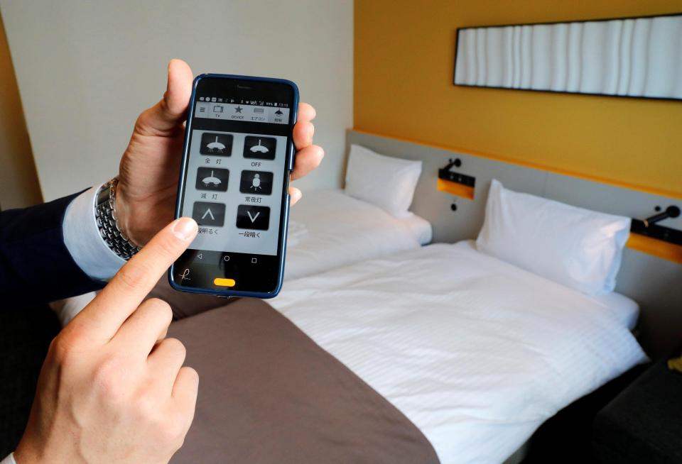  Guests can control different functions in their rooms, such as air conditioning, with smartphones at the cutting-edge hotel in Japan