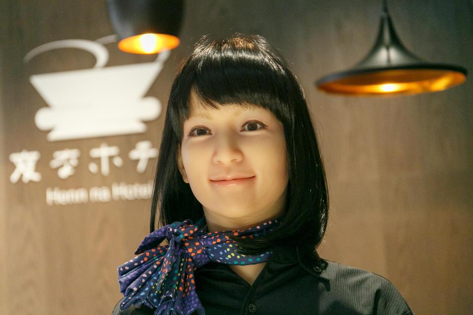  A smiling robot greets guests at the high-tech Tokyo hotel