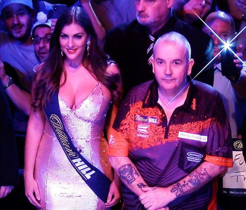  Phil Taylor with a walk-on girl at this year's final at Ally Pally