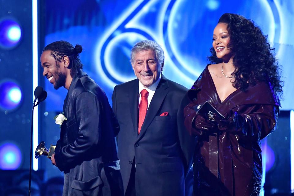  The singer picked up an award with Kendrick Lamar - who chose to wear the corsage