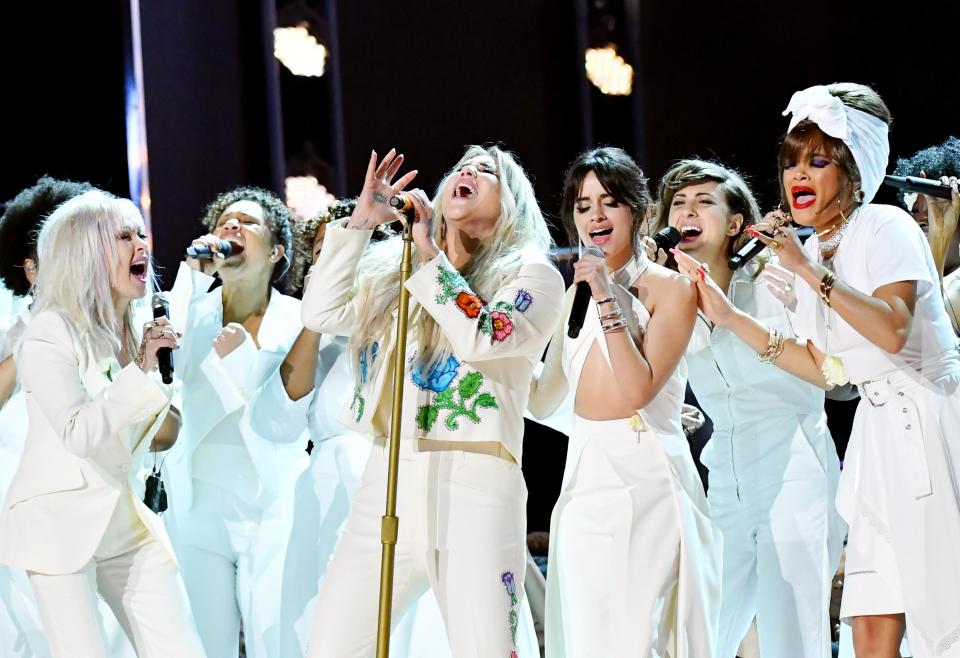  Performing a heartbreaking rendition of her song Praying, the star was flanked by a choir of fellow singers including Camila Cabello, Bebe Rexha and Cyndi Lauper.