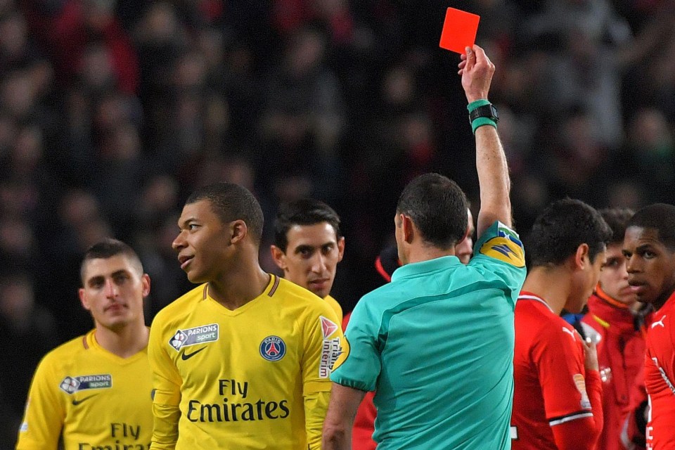 Kylian Mbappe turns away in frustration after being sent off