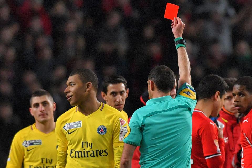  Kylian Mbappe turns away in frustration after being sent off