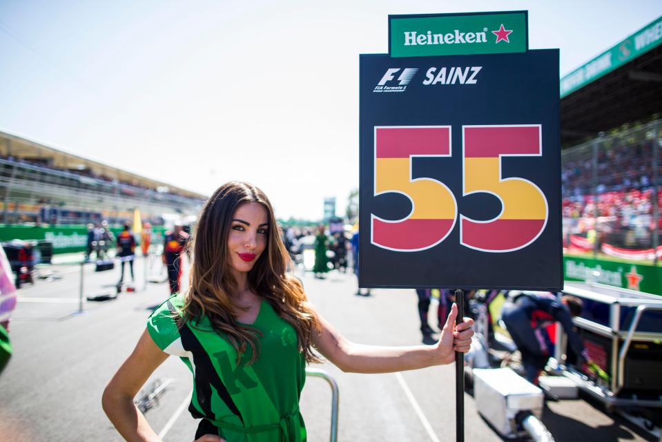  This grid girl of Carlos Sainz of Spain and Scuderia Toro Rosso is now out of work