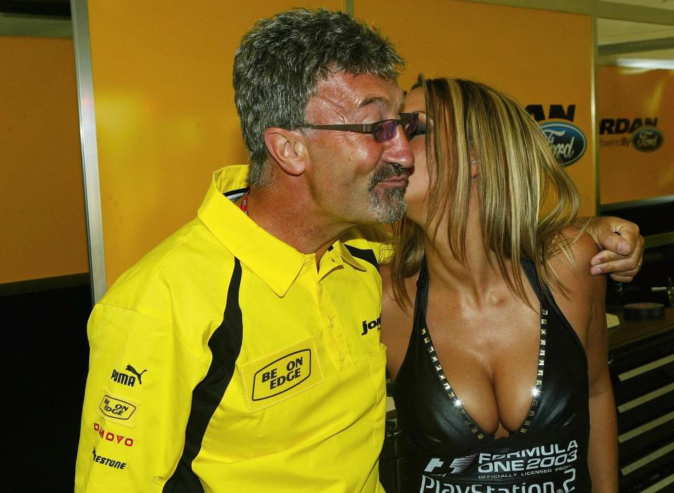  Jodie Marsh shares a kiss with Jordan team owner Eddie Jordan at the British Grand Prix in 2003