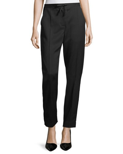 Meghan wore a pair of sold out woollen Burberry trousers