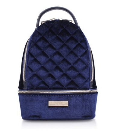  This navy blue velvet bag features a quilted design on the front and silver zip detailing. It has been reduced from £69 - a  saving of 72 per cent