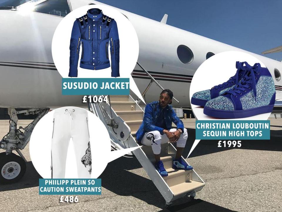  Pierre-Emerick Aubameyang dressed in blue and white on steps of private jet