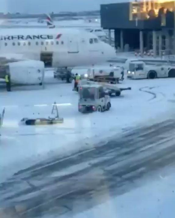 The worker was caught by a waiting passenger in the terminal spinning donuts on the runway