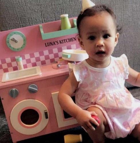  Chrissy Teigen and John Legend's toddler Luna posing with her personalised play kitchen by My 1st Years