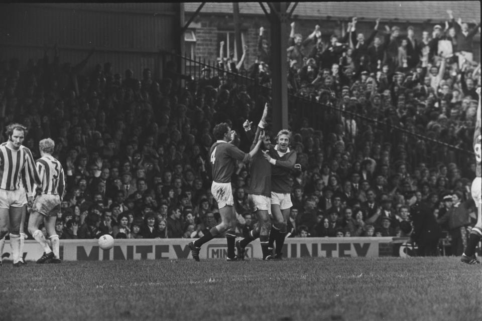 Denis Law, George Best and Bobby Charlton celebrate during a 3-0 win against Huddersfield in 1971