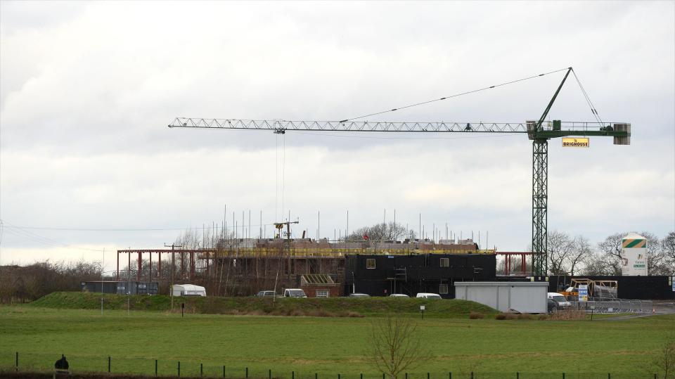  Cranes and lorries are being put to use on Wayne Rooney's new home