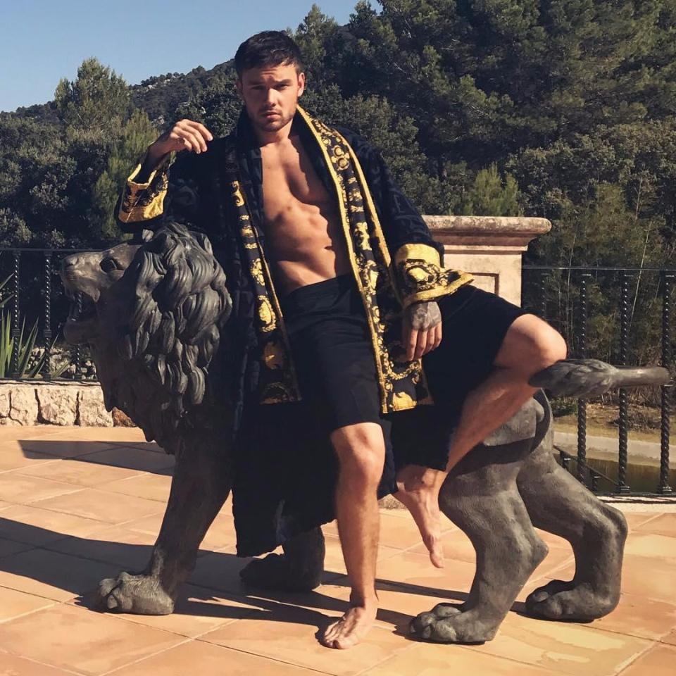  He inexplicably posed on a lion statue in another fetching ensemble for an Instagram picture