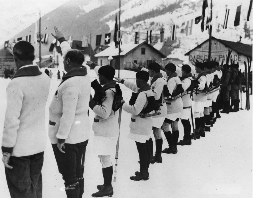  French athletes swear to uphold the Olympic spirit in what looks like a forerunner of the Nazi salute