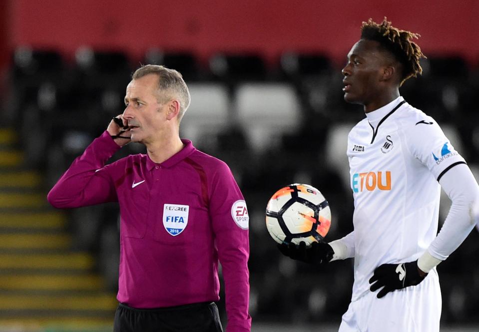  Play is stopped at Swansea as referee Martin Atkinson calls for help from VAR