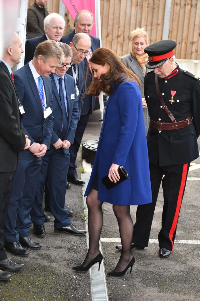  Staff could not help but watch the heavily pregnant Duchess skillfully weave her heel out of the metal grate