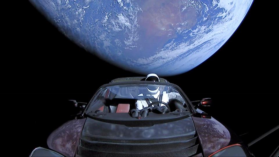  On the upper stage of the Falcon Heavy rocket is Elon Musk's Tesla Roadster