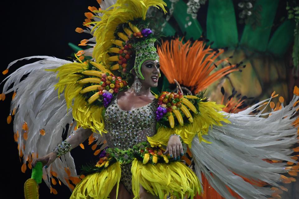  A reveller of the Rosas de Oura samba school takes to the parade to be a part of the annual performance