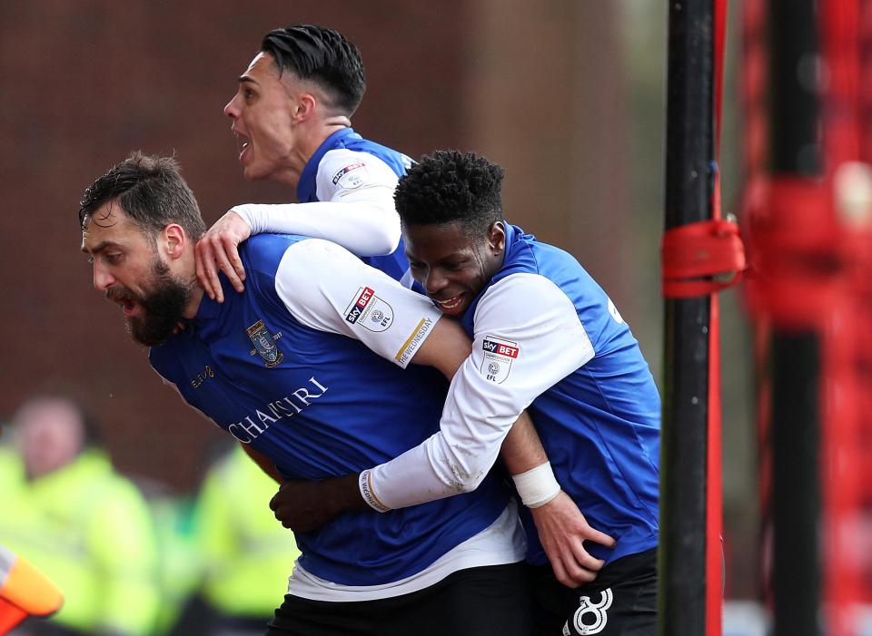 The Kosovan international celebrates with his team-mates