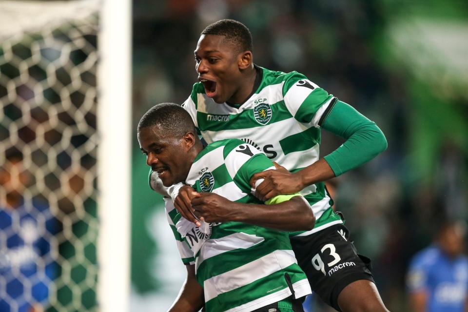  William Carvalho (L) celebrates with goalscorer Rafael Leao during the Sporting and Feirense clash