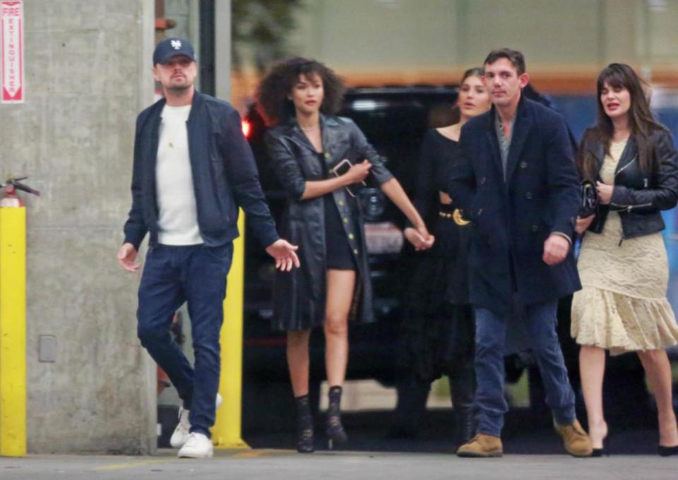  Leonardo DiCaprio was seen arriving with a group of friends, dressing down in jeans and a baseball cap