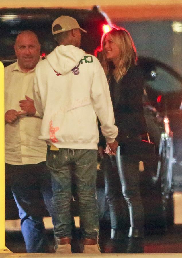  Jennifer Aniston hugged and held hands with Pharrell Williams as she said goodbye. She celebrated her 49th birthday the following day