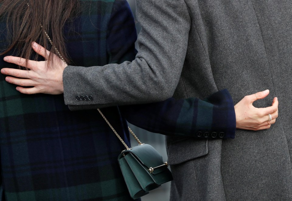 Meghan Markle and Prince Harry strolled arm-in-arm as they were greeted by royal fans in Scotland