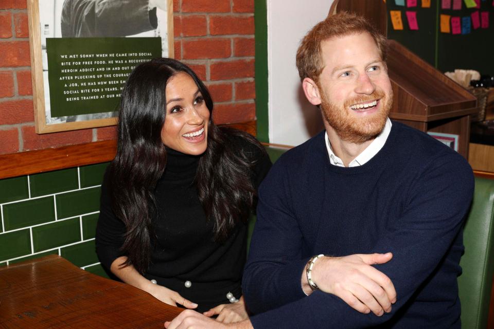  Prince Harry and Meghan Markle speak with patrons at the Social Bite in Edinburgh, Scotland