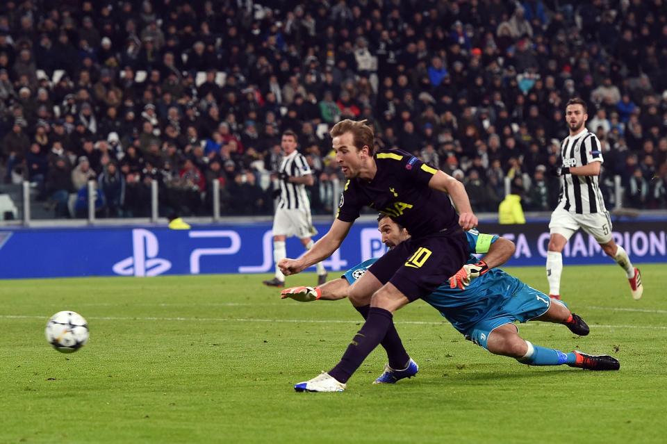  Harry Kane rounds Gianluigi Buffon to score for Tottenham in Turin