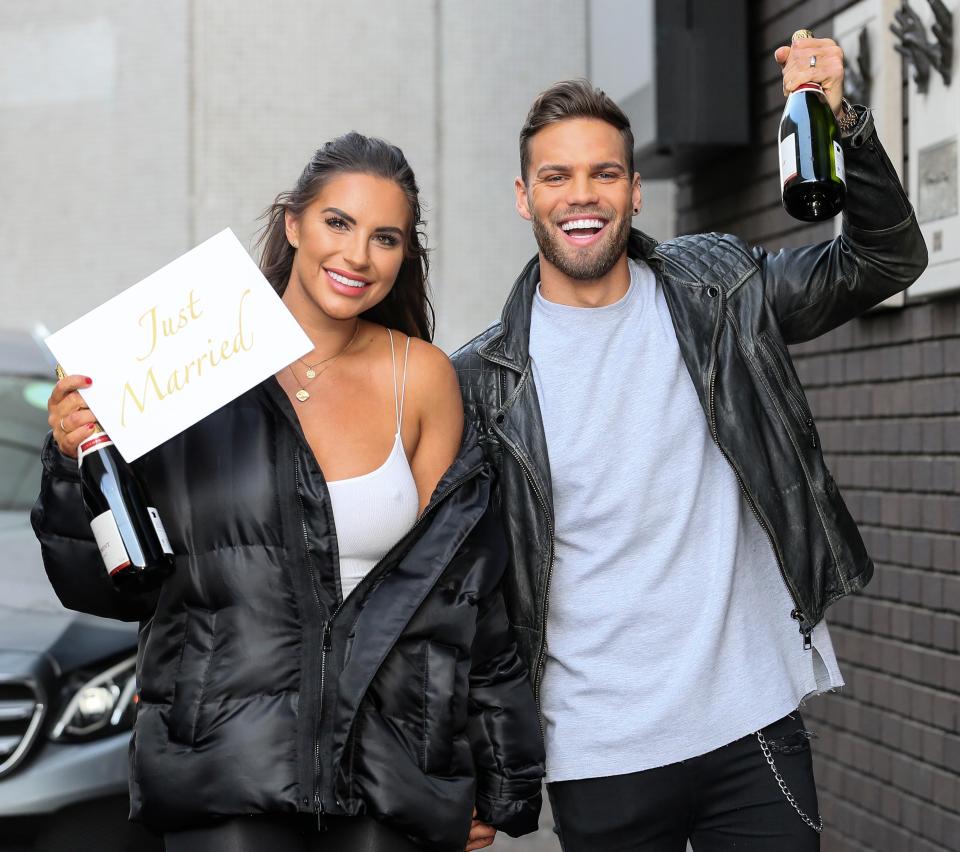  The couple were pictured holding a 'Just Married' sign and champagne as the left the studios