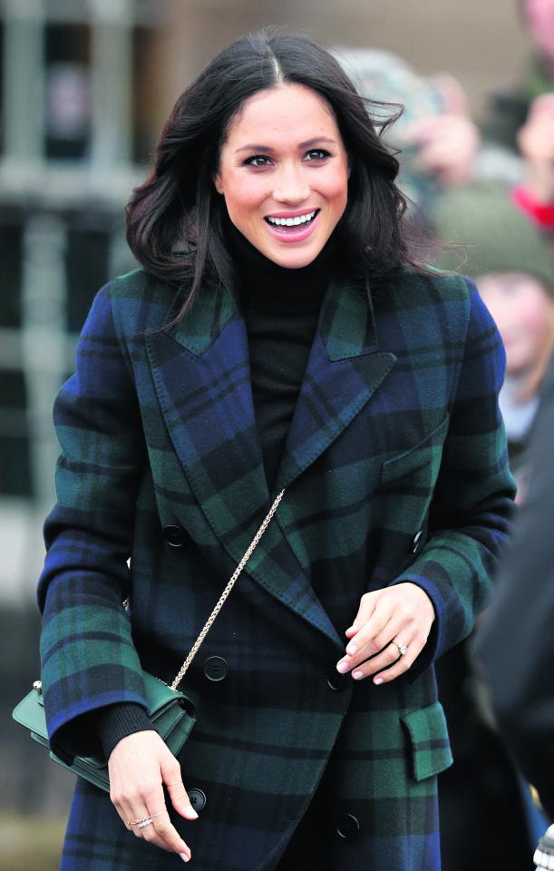  Meghan was snapped wearing a dainty gold ring on her right hand