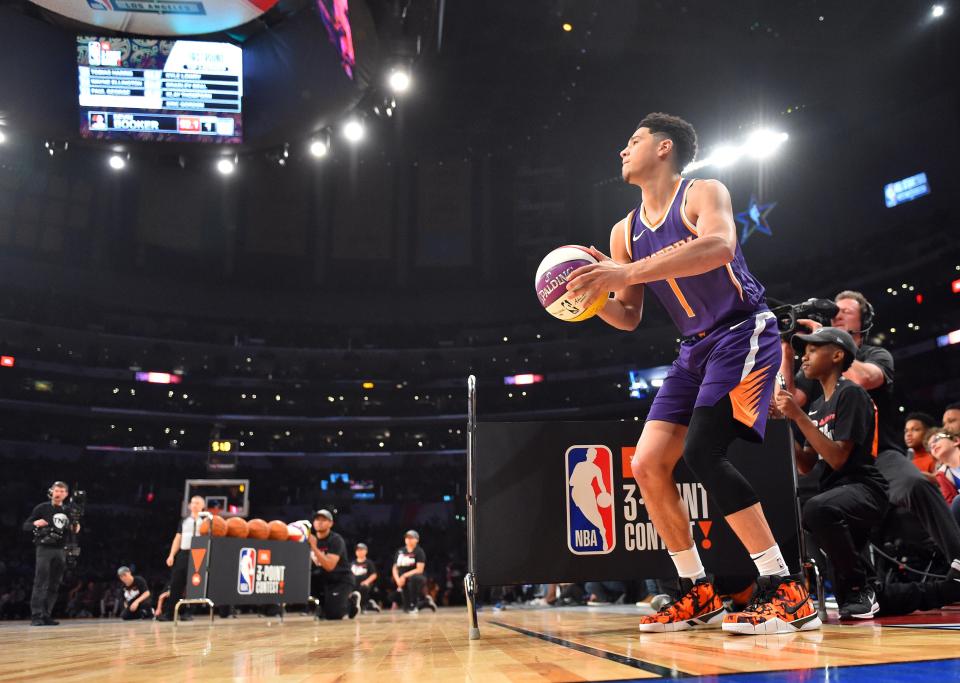 Phoenix Suns youngster Devin Booker put in a record shift to win the three-point contest