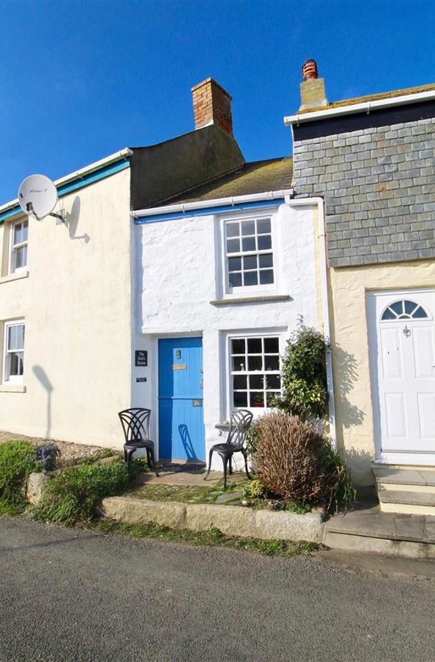  The 'Dolls House' has been built in an alleyway between two houses and stands at 9ft-wide