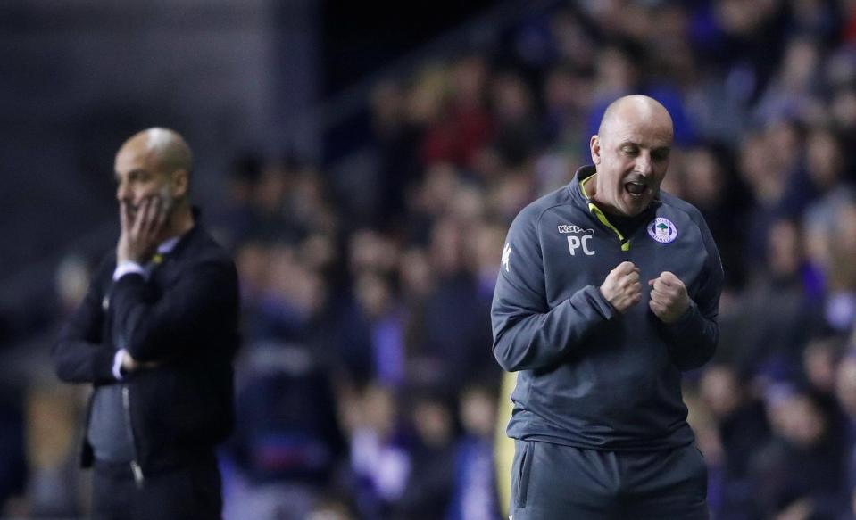  Paul Cook celebrates after beating Manchester City in FA Cup fifth round clash