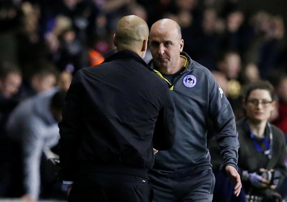  Pep Guardiola and Paul Cook shake hands after famous FA Cup clash