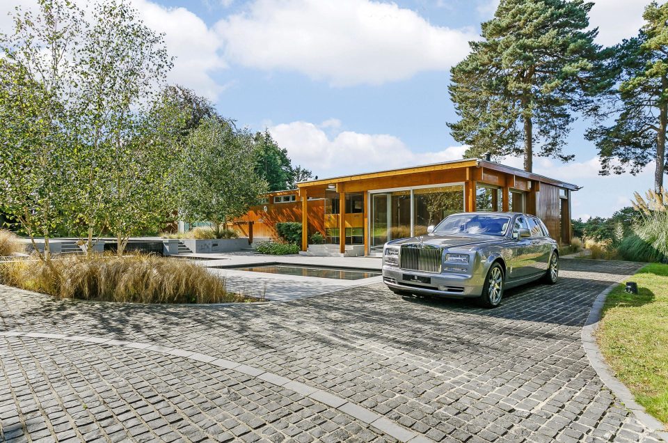  Real Goldfinger's home is a glass-walled modern masterpiece nestled