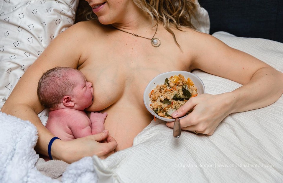 A mum refuels as her infant has a feed shortly after birth 