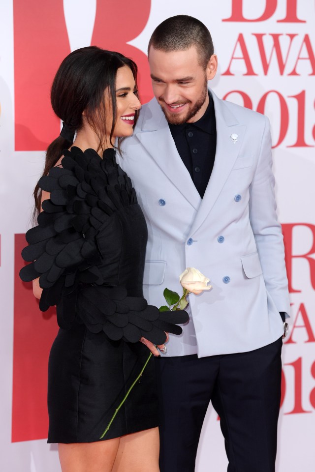 Liam gazed at his girlfriend as she held a white rose