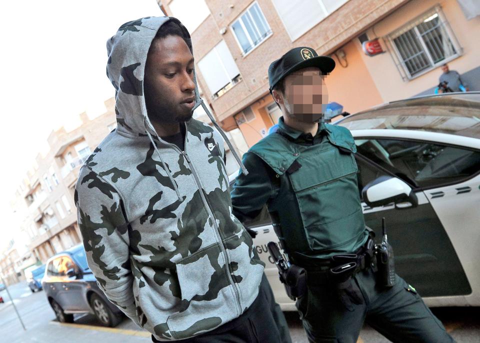  Ruben Semedo is placed in handcuffs as he goes to testify in a court in Valencia